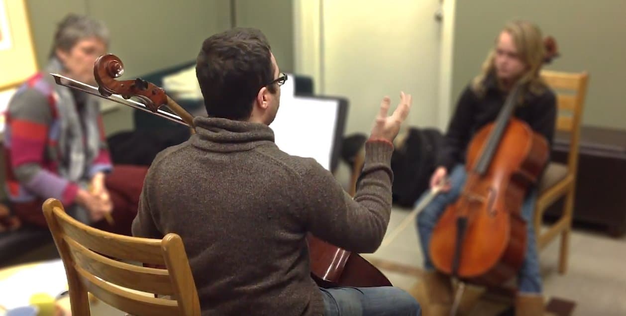David teaching a cello lesson with student